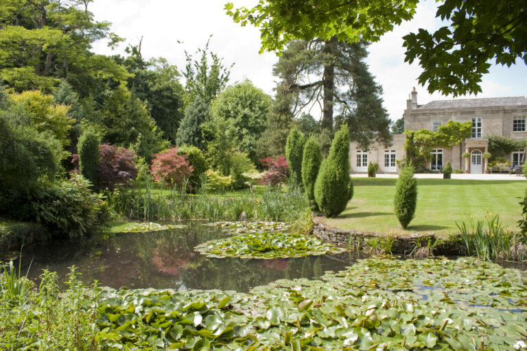 Pond, gardens and main country house at Guyers House Hotel & Restaurant