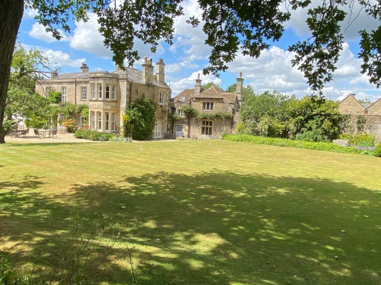 Gardens, outdoor dining area and main country house at Guyers House Hotel & Restaurant